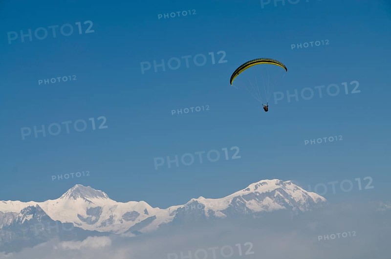 Paraglider sailing through the air