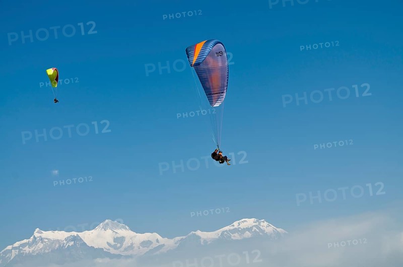 Paraglider sailing through the air