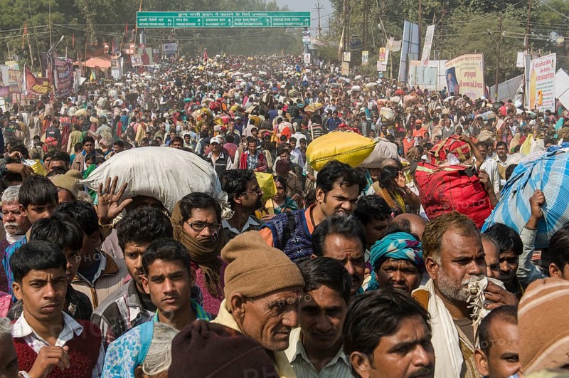 Crowds of people arriving at Kumbha Mela grounds