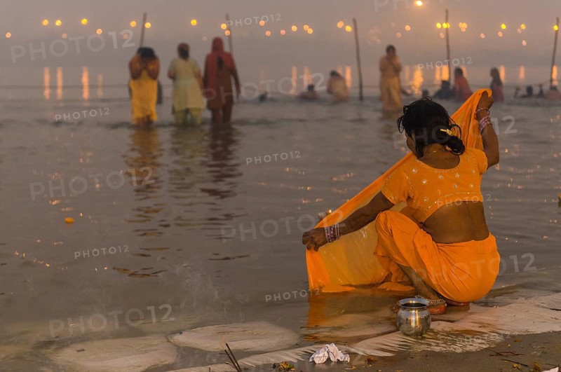 Woman washing her sari in the Sangam