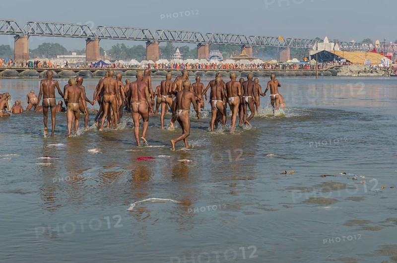 Taking a purifying bath in the river Ganges as part of the initiation of new sadhus