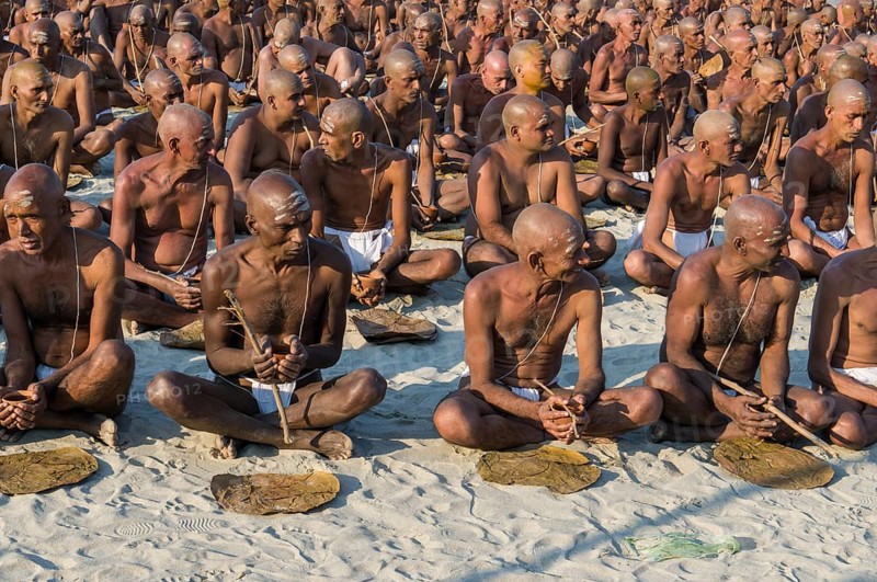Taking their first meal in their new lives as part of the initiation of new sadhus