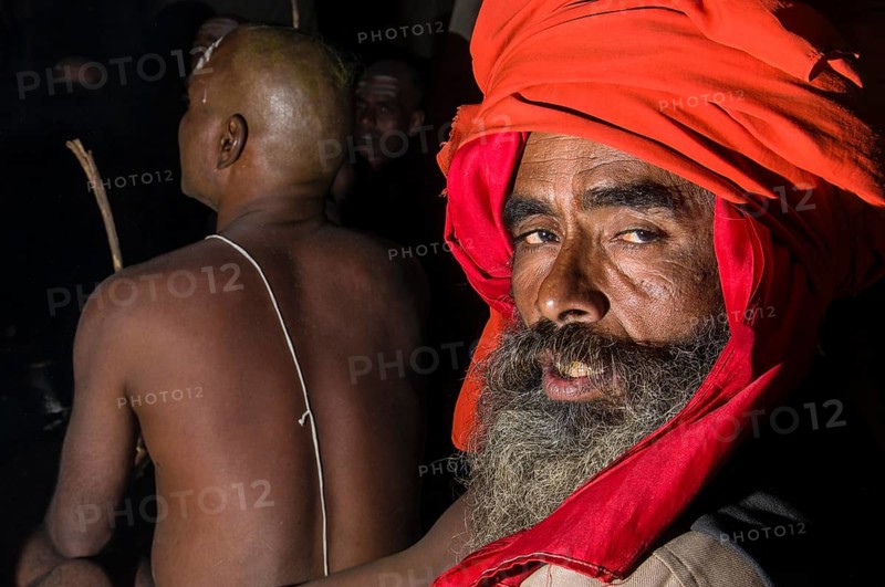 Portrait of a guru guiding the initiation of new sadhus
