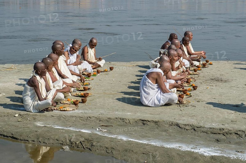 Group of new Jain nuns sitting at the banks of the river Ganges during their initiation