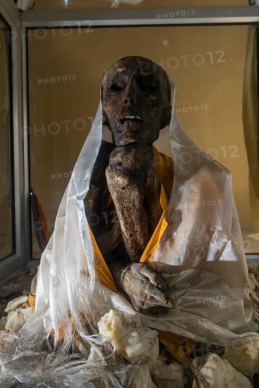 Mummy of a monk from 15th century in a glas container at a temple