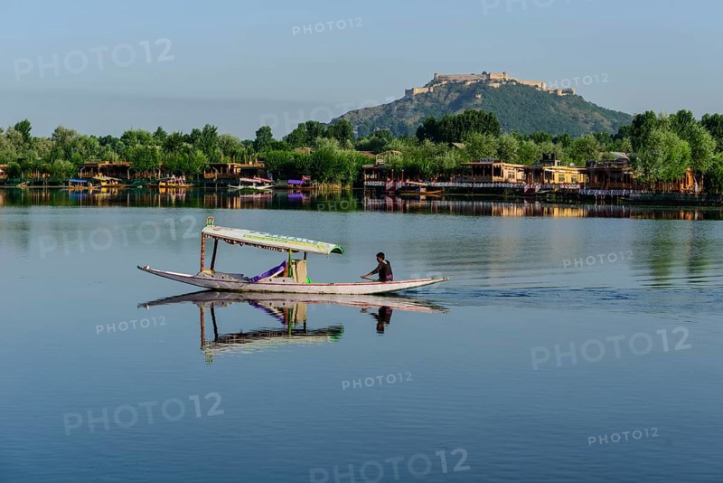 A shikara boat crossing Dal Lake