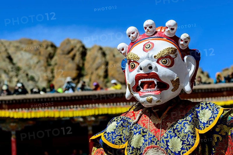 Monk performing ritual mask dance