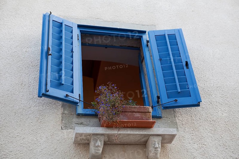 Window with blue shutters