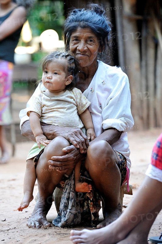 Elderly woman with a child on her lap