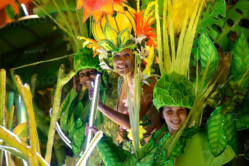 Dancers in colourful costumes on floats