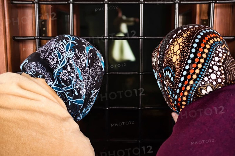 Women looking through a window