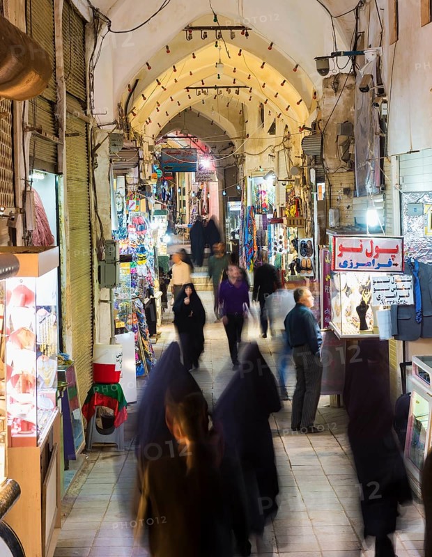 People and shops in the old Kashan bazaar