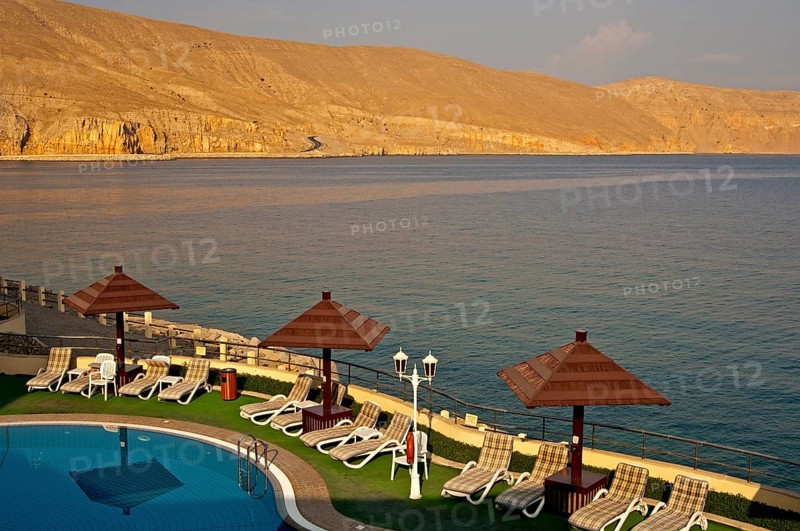 View of the coast of the Musandram Peninsula from the swimming pool area at the Golden Tulip Resort Hotel