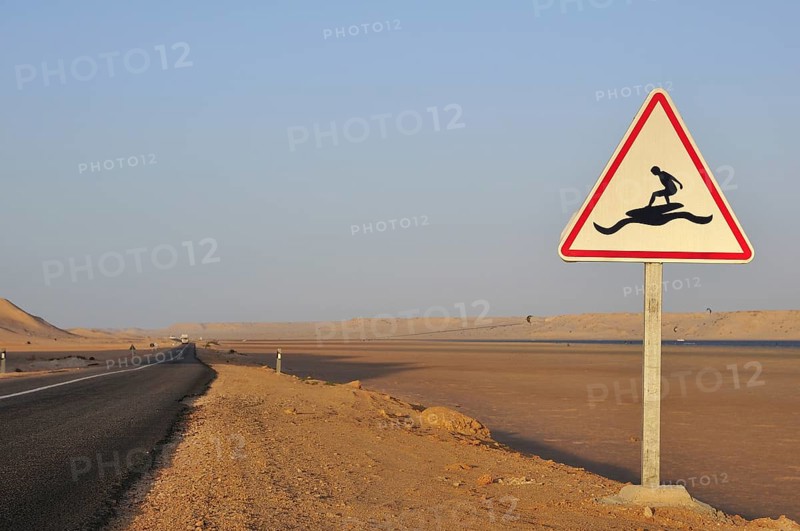 Road sign 'Caution Surfers' at the Rio de Oro Bay