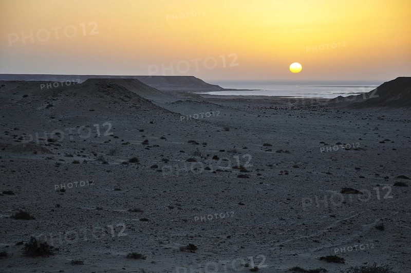 Sunset over the stone desert at the Rio de Oro Bay
