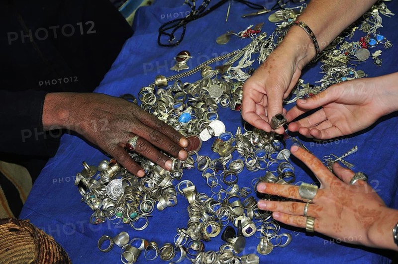 Female hands touching silver Berber jewellery