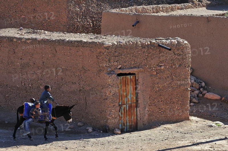 Donkey riders in the Kasbah Tamnougalt near Agdz