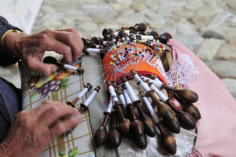 Old woman making lace