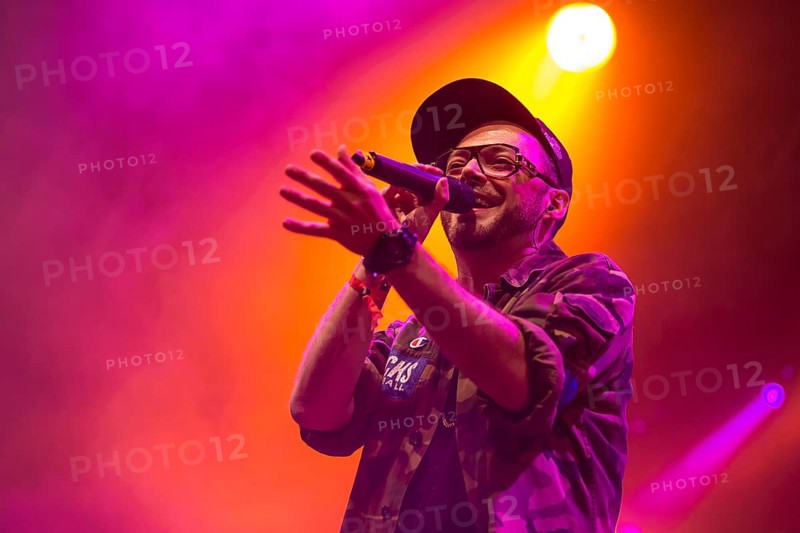 Swiss rapper Greis performing live at the Heitere Open Air music festival