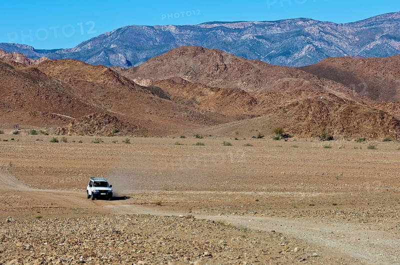 Mitsubishi SUV on a dirt road