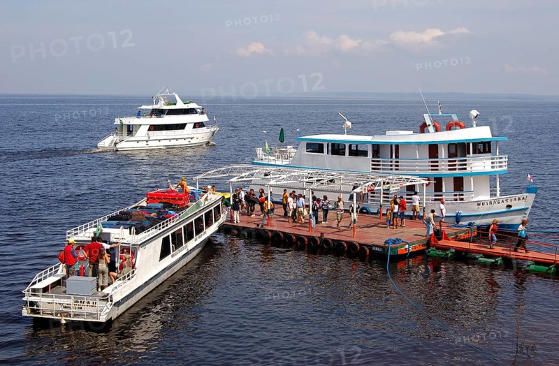 Motorboats at a dock on the Rio Negro river