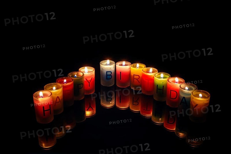 Birthday candles with letters forming the words 'Happy Birthday'