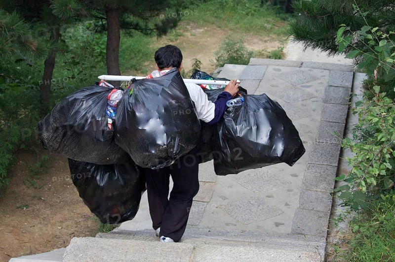 Garbage collector at the Great Wall of China