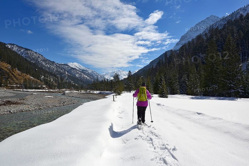 Snowshoe walkers at Rissbach stream