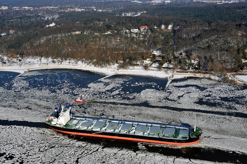 Ship on the Elbe River with ice flow