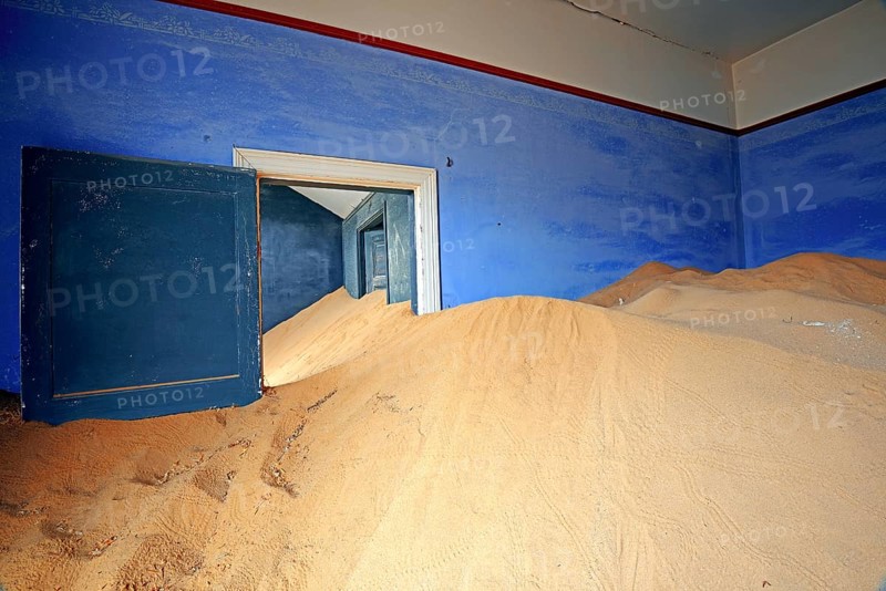 Building taken over by sand from the desert