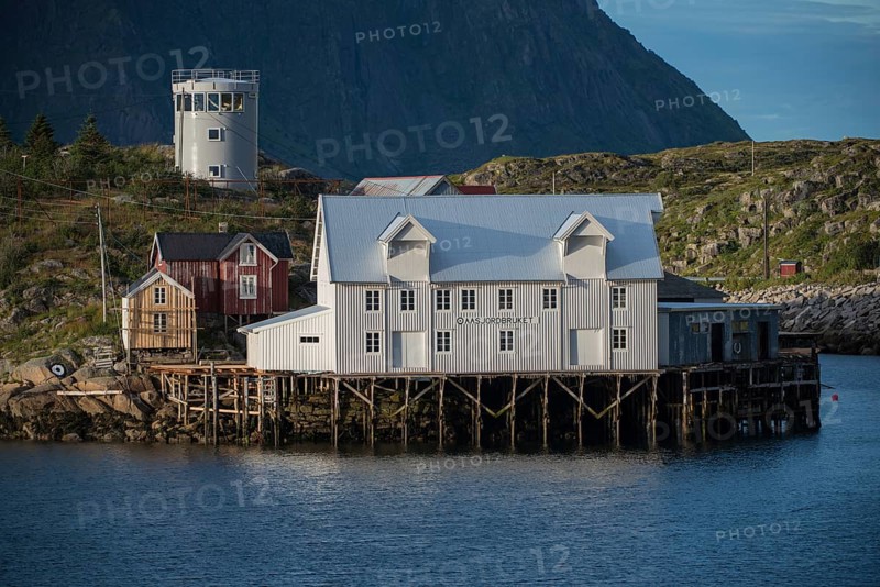 White warehouse by the fjord