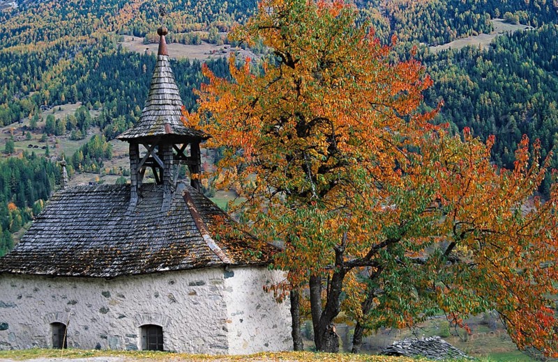 Chapel of Grimentz with trees in autumn