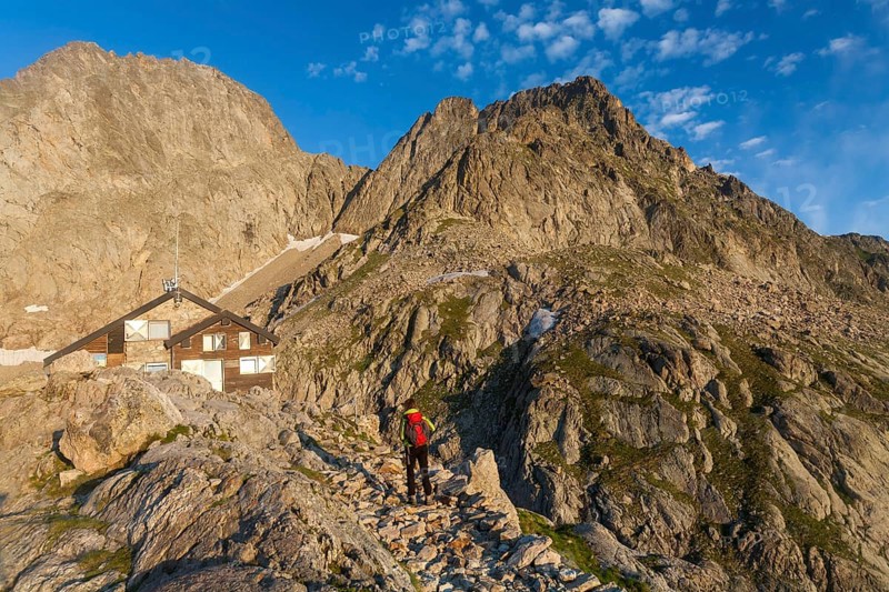 Hiker at Rifugio Pagari mountain hut