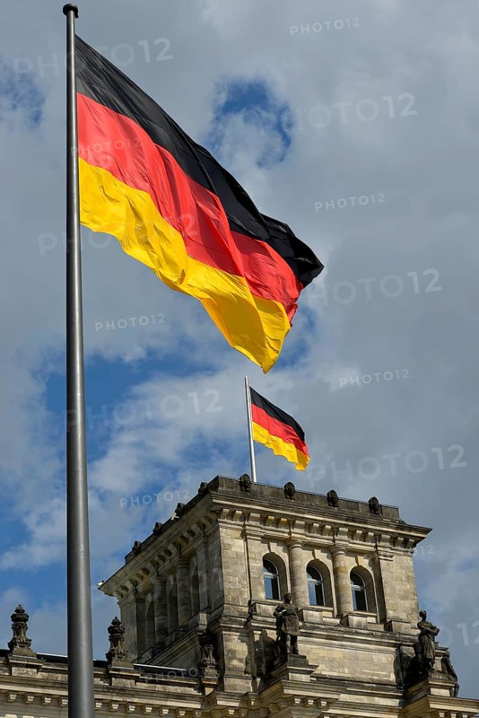 German flags flying on the Reichstag Building