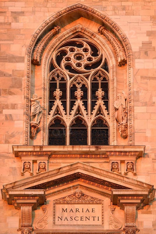 Window over the main portal of the west facade of Milan Cathedral or Duomo di Santa Maria Nascente