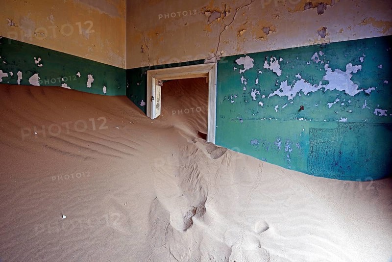 Building taken over by sand from the desert
