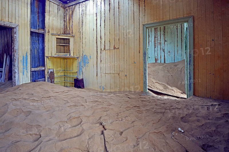 Building taken over by sand from the desert