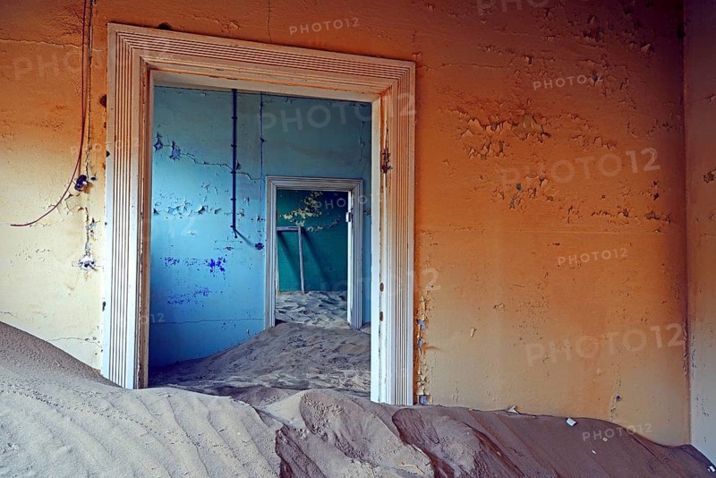 Building taken over by sand from the desert