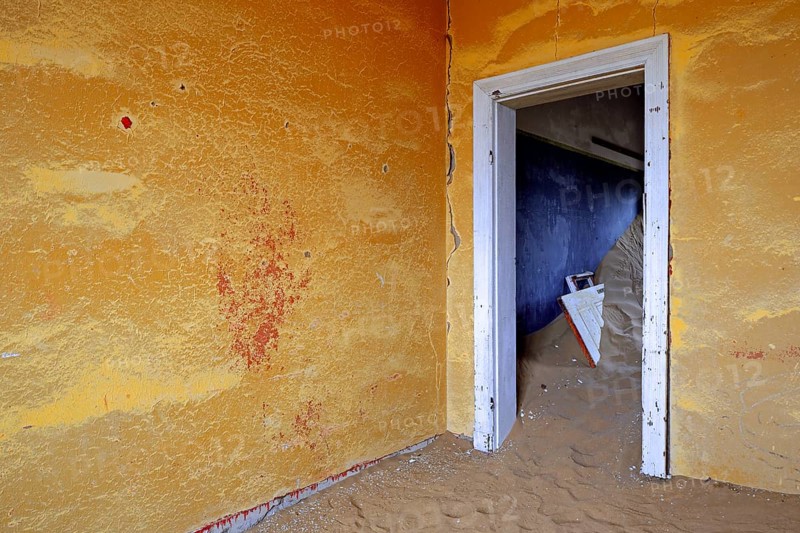 Building taken over by sand from the desert