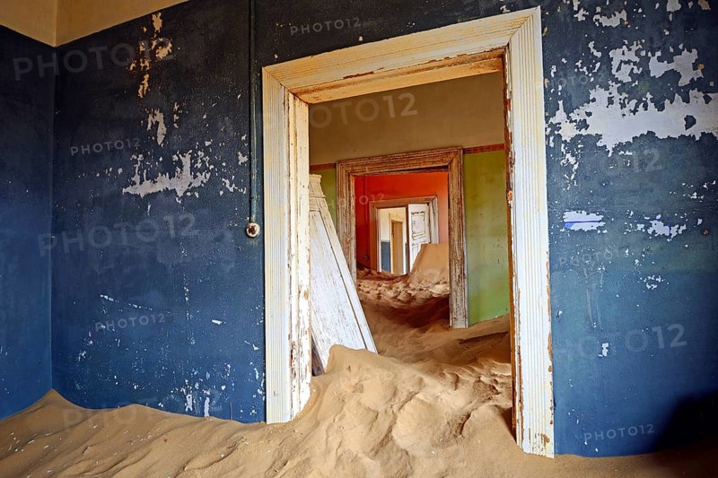Room in a house that has been filled by desert sand