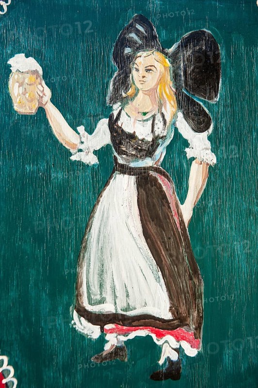 Painted window shutter with woman in traditional costume