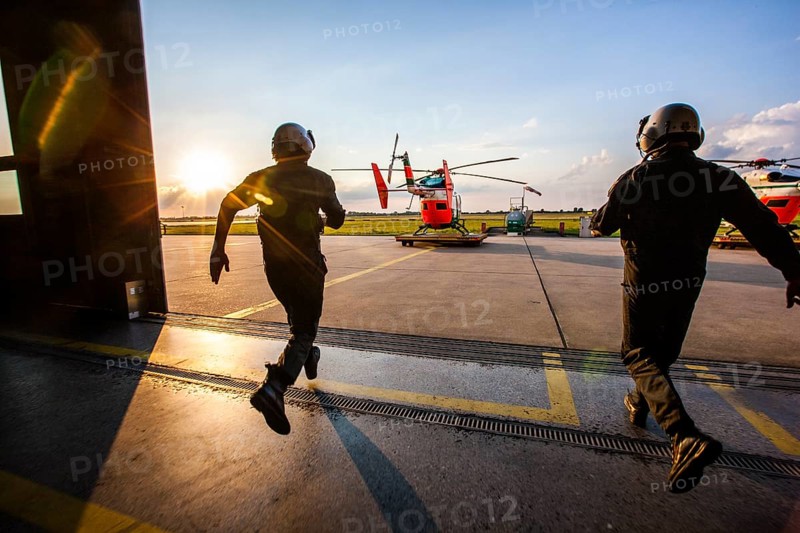 Pilots sprinting towards a helicopter