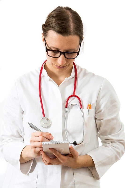 Female doctor taking notes