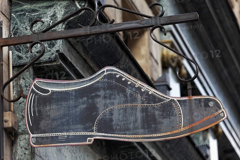Shop sign of an old fashioned shoe shop