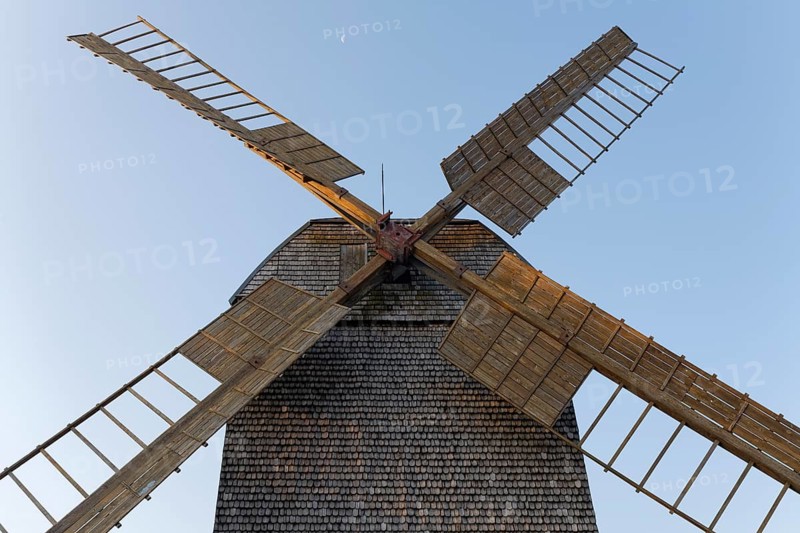 Historic post windmill with wooden shingle cladding