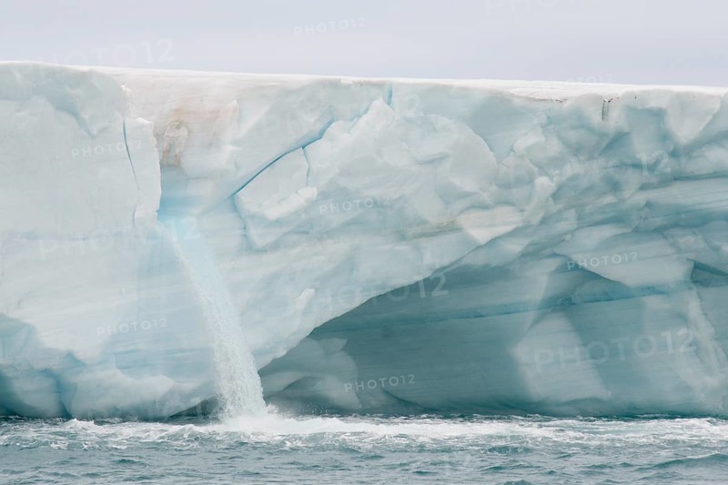 Meltwater waterfall at the glacier front of Brasvellbreen