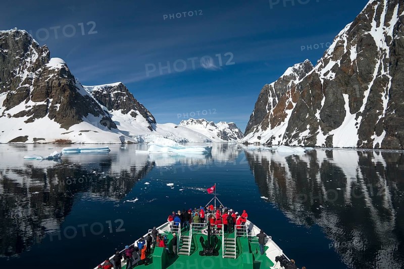 Visitors on the bow of the expedition cruise ship
