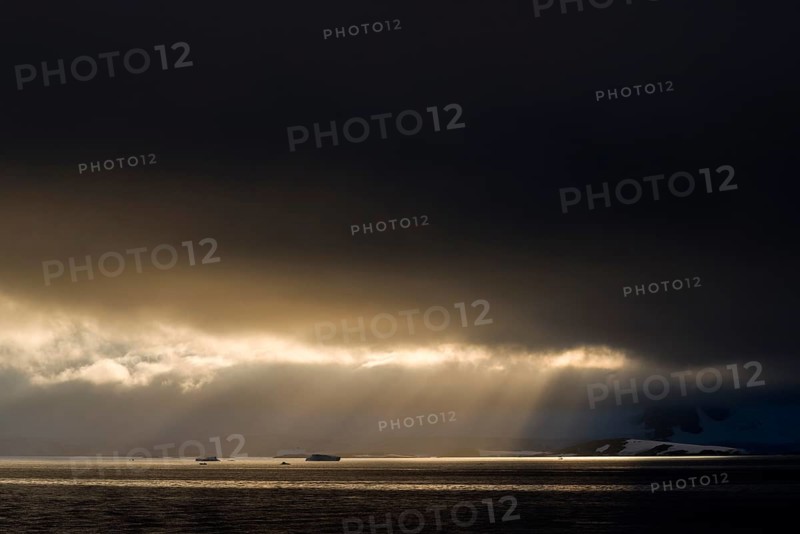 Sunlight shining through a hole in the clouds