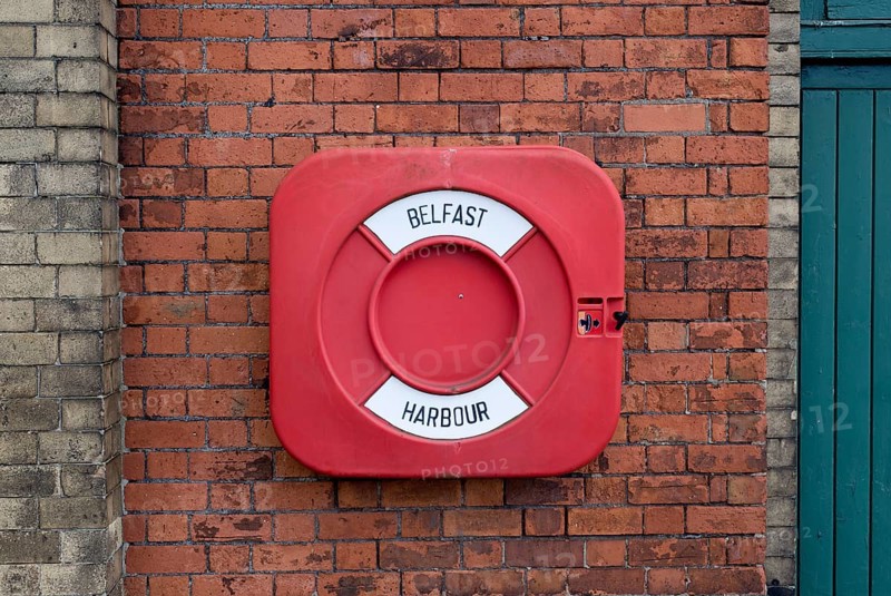 Life buoy on a brick wall