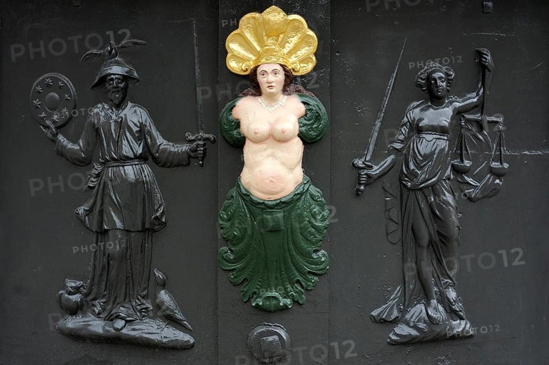 Three relief figures on Roehrenbrunnen fountain of 1727